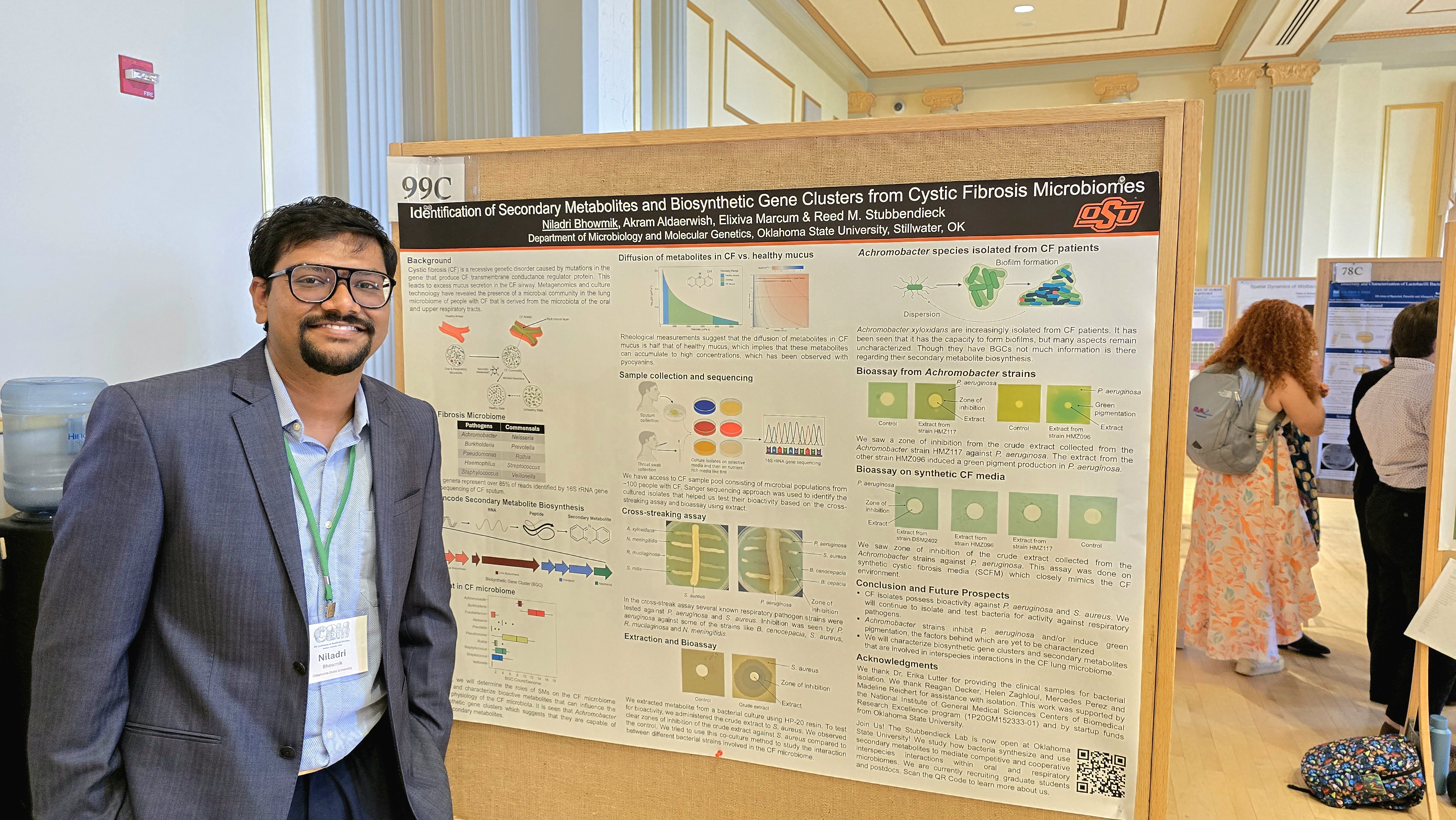 Photograph of Niladri presenting his poster at the Conference on Beneficial Microbes