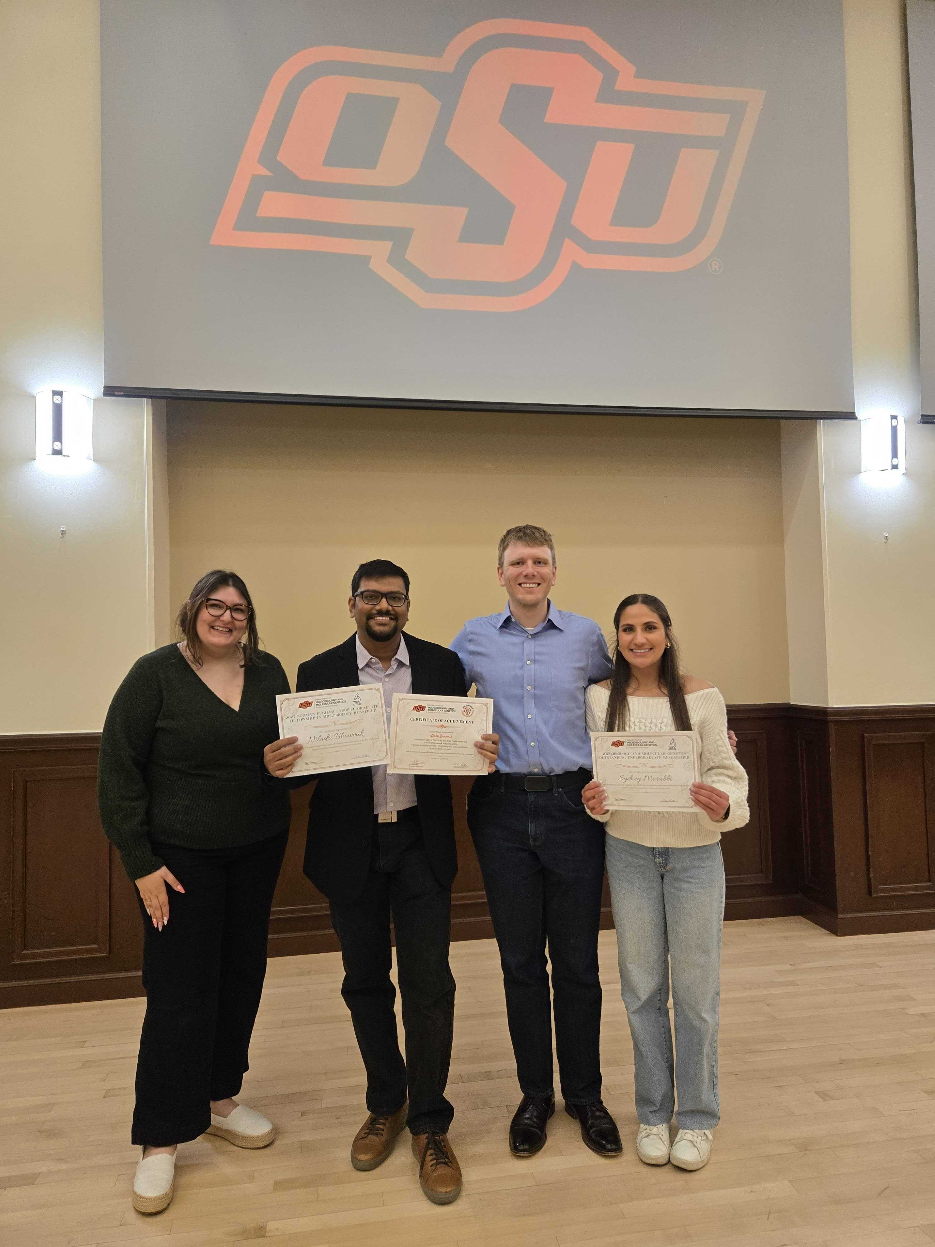 Madeline, Niladri, Reed, and Sydney at the Annual Microbiology and Molecular Genetics Award Ceremony